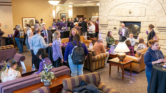 K-State Faculty and Staff gathering for a happy hour in the Tointon Great Room