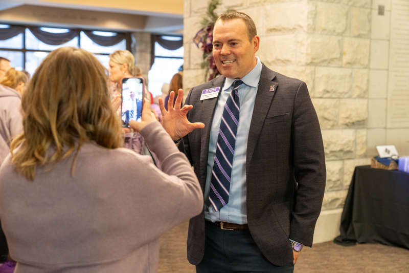 K-State Alumni Association president and CEO, Adam Walker, recording an Instagram Reel