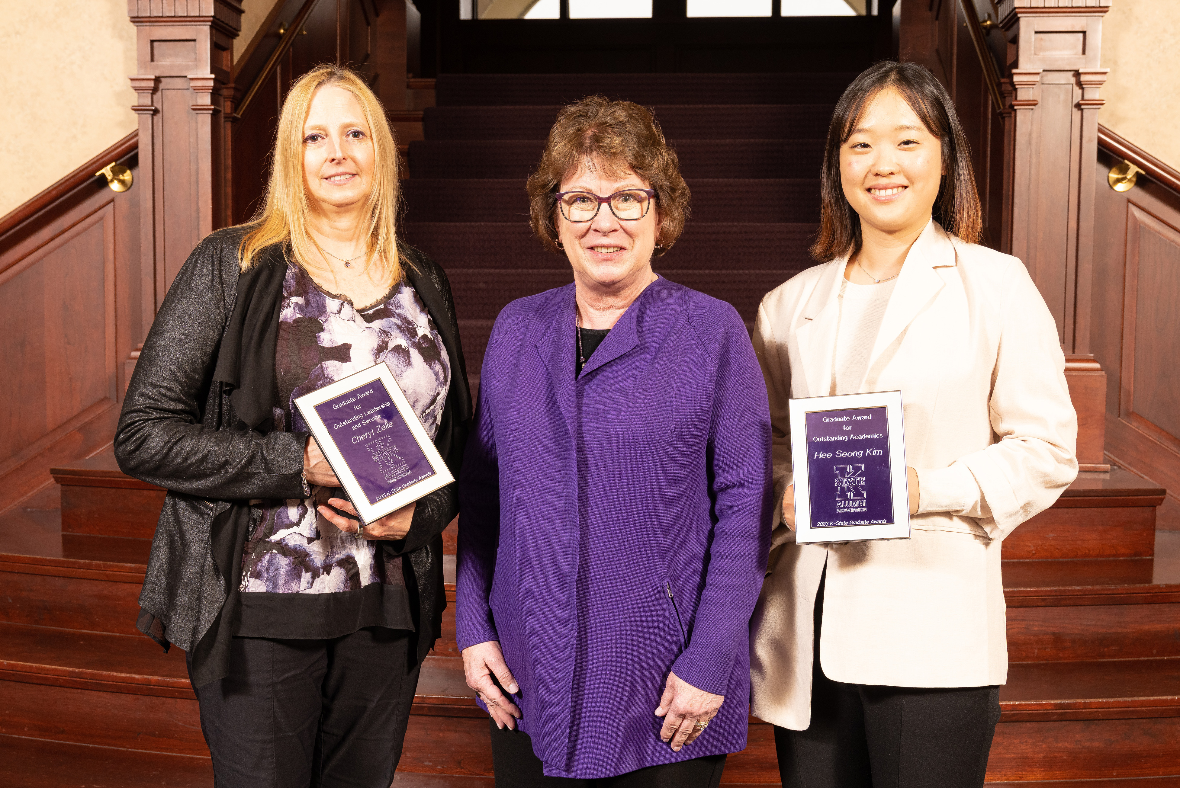 Graduate Award recipients display their plaques with K-State Alumni Association CEO and President Amy Button Renz