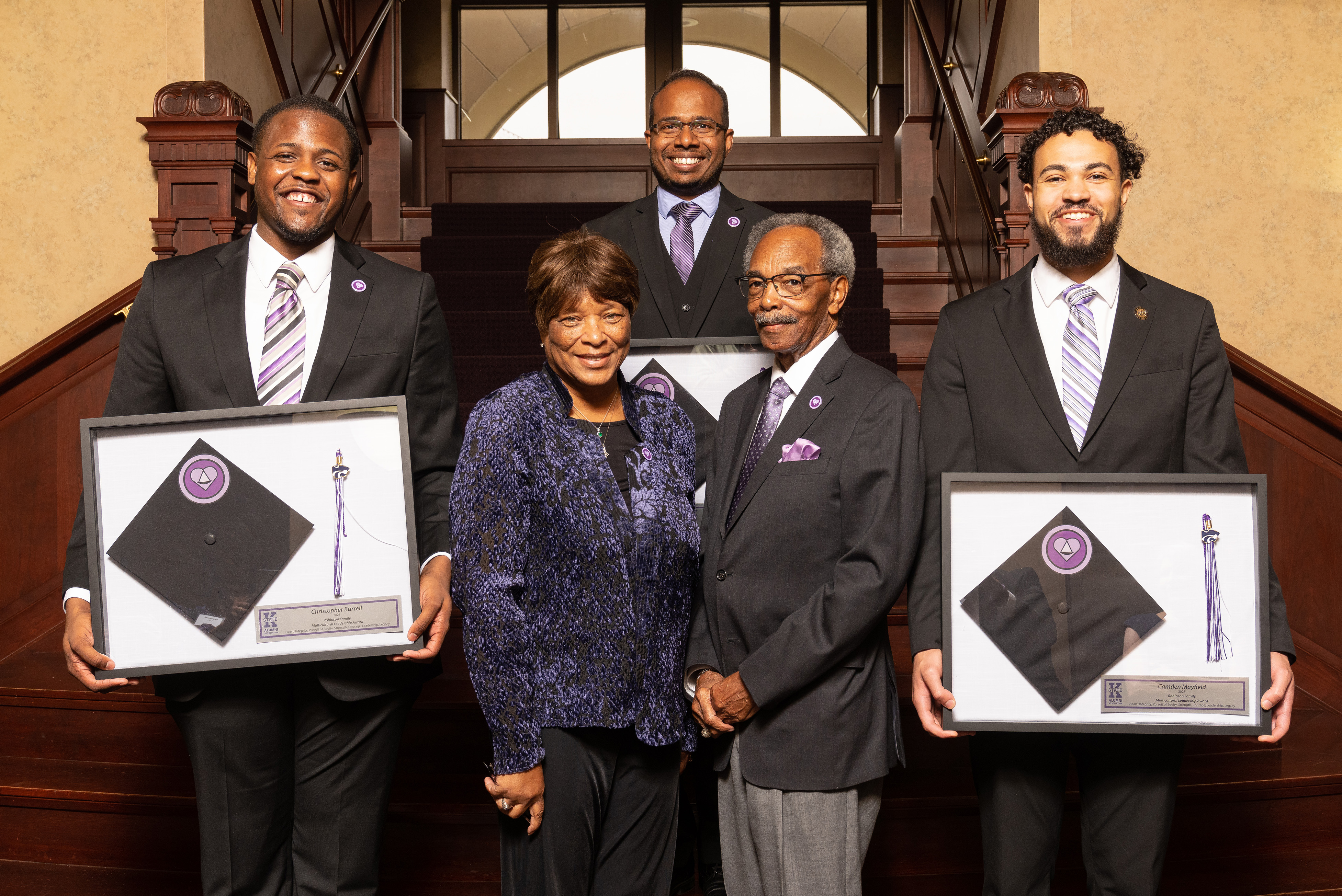 Robinson Family Multicultural Leadership Award recipients with their shadow boxes and Roy and Silvia Robinson
